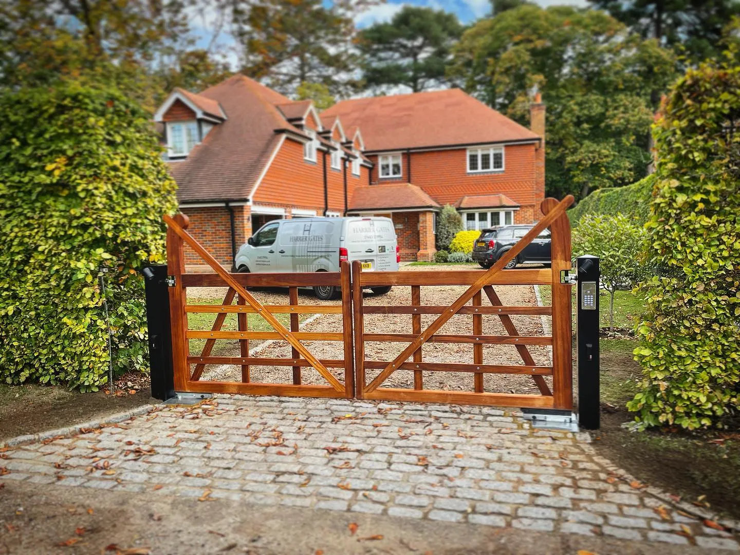 farm style wooden driveway gates with entry system
