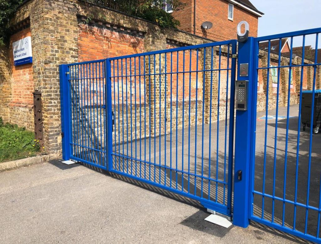 industrial blue electric gates with keypad entry